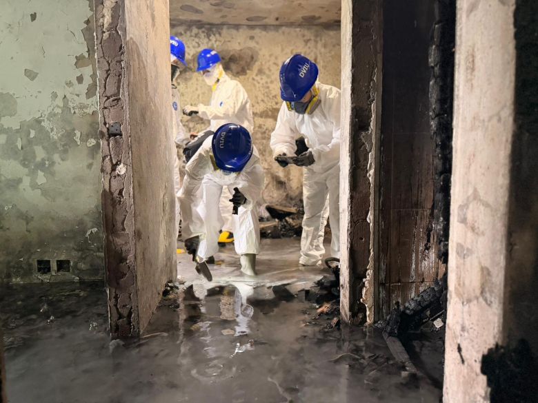 Specialist police search the apartments in Wang Fuk Court complex on Sunday