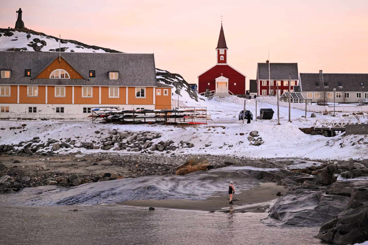 A woman comes out of the water in Nuuk